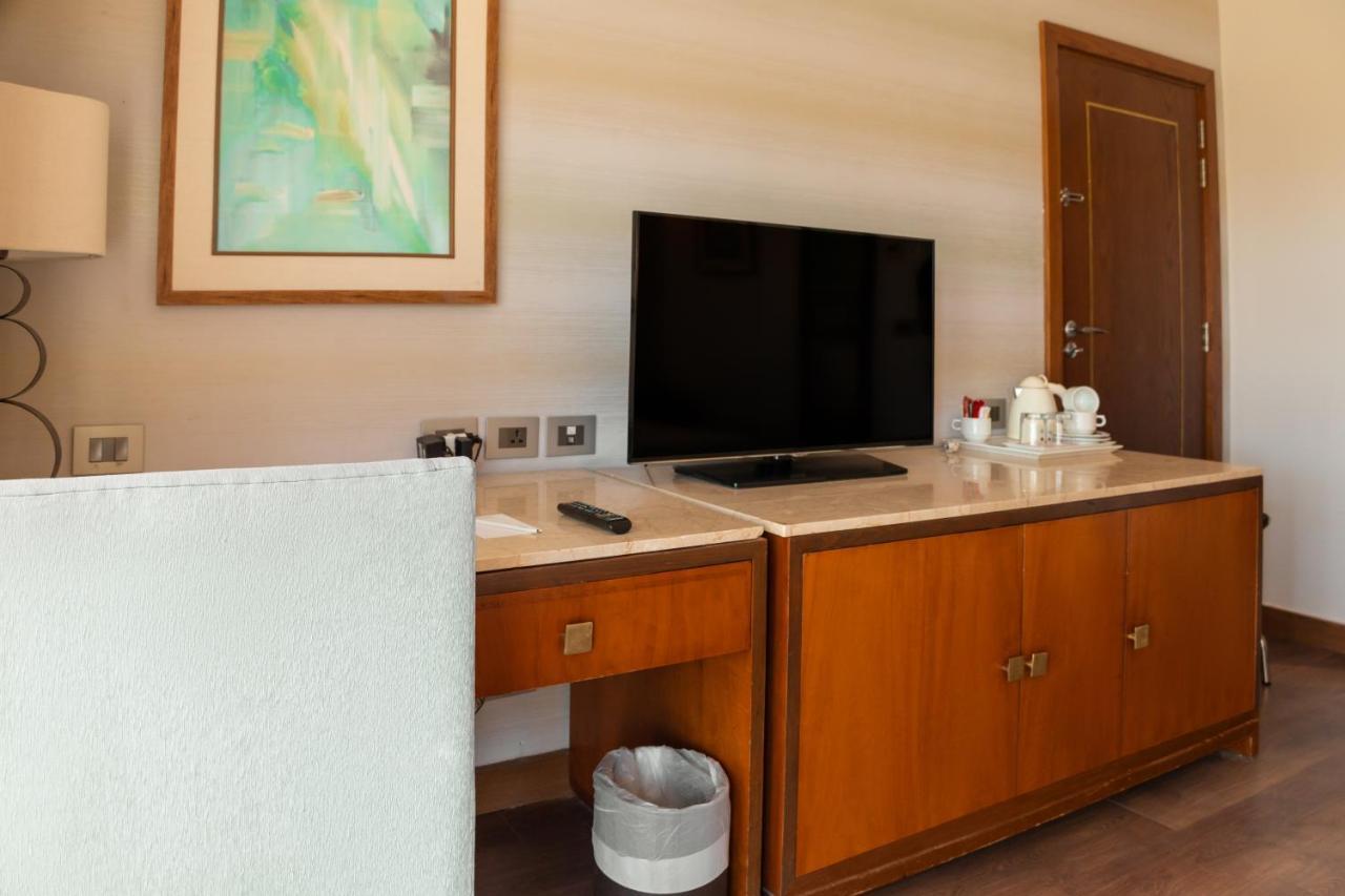 Sharm Dreams Vacation Club - Aqua Park Hotel Екстериор снимка A television in a hotel room